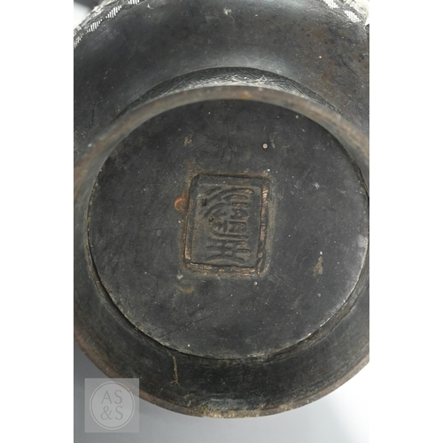 341 - A 19th century Chinese bronze twin handled vase in the form of an archaic ritual vessel, low relief ... 