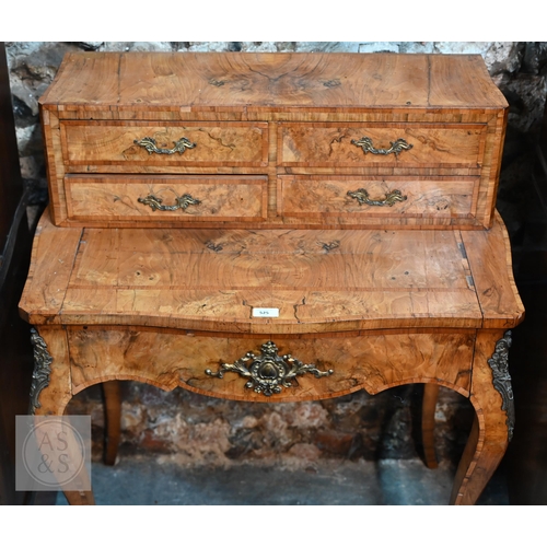 525 - A French ormolu mounted crossbanded walnut ladies bonheur de jour, late 19th century, the top with f... 