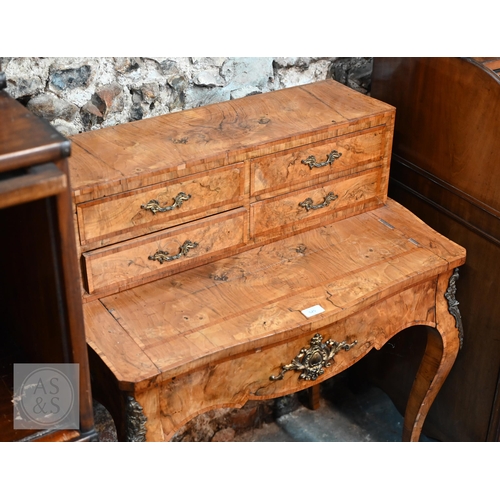 525 - A French ormolu mounted crossbanded walnut ladies bonheur de jour, late 19th century, the top with f... 