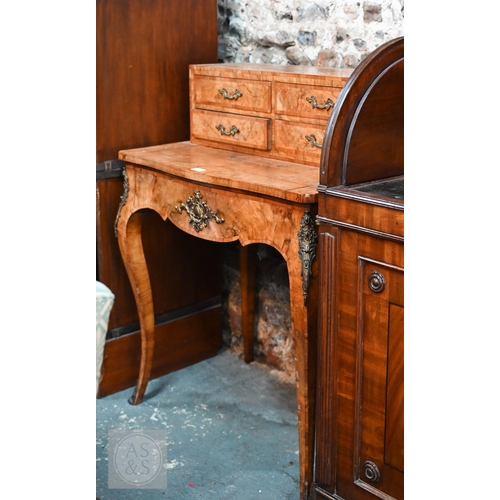 525 - A French ormolu mounted crossbanded walnut ladies bonheur de jour, late 19th century, the top with f... 