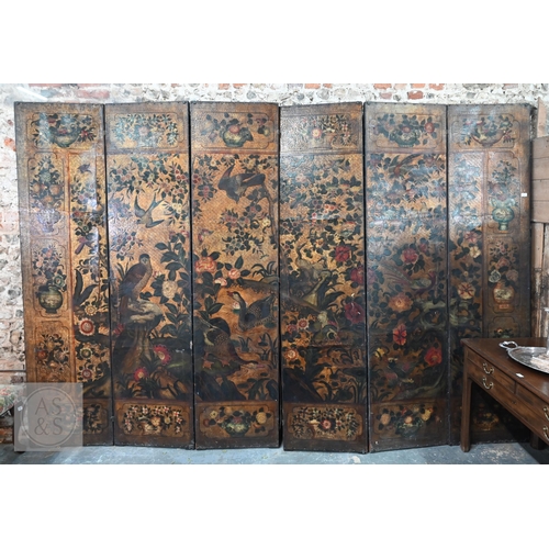 526 - A large antique continental floor standing six panel folding wood and leather screen, hand-painted p...