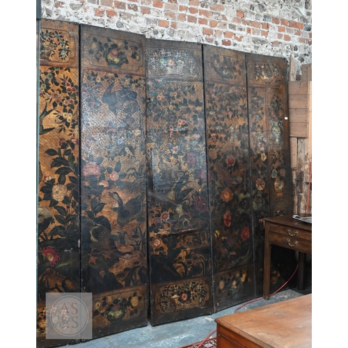 526 - A large antique continental floor standing six panel folding wood and leather screen, hand-painted p... 