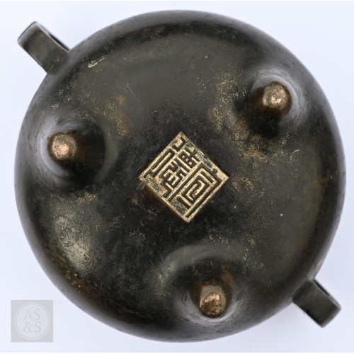 310 - A 17th/18th century Chinese bronze censer (incense burner) and original stand, the censer with compr... 