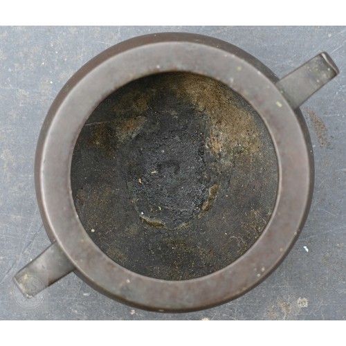 310 - A 17th/18th century Chinese bronze censer (incense burner) and original stand, the censer with compr... 