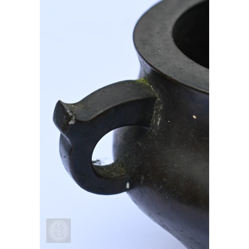 310 - A 17th/18th century Chinese bronze censer (incense burner) and original stand, the censer with compr... 