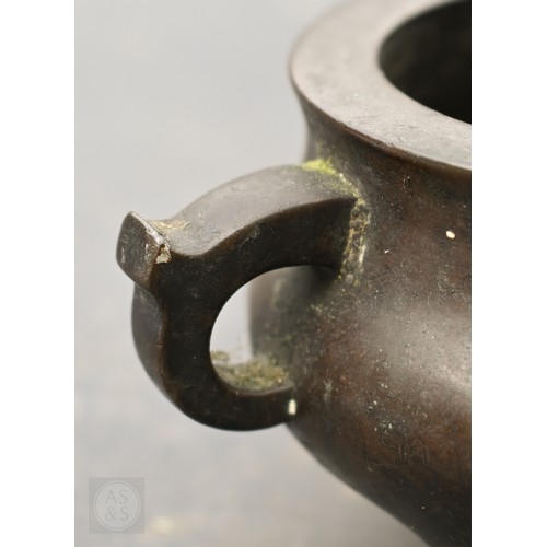 310 - A 17th/18th century Chinese bronze censer (incense burner) and original stand, the censer with compr... 