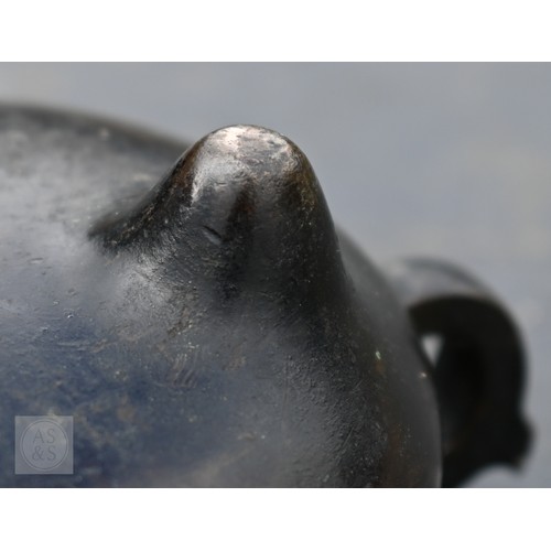 310 - A 17th/18th century Chinese bronze censer (incense burner) and original stand, the censer with compr... 