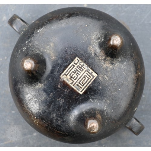 310 - A 17th/18th century Chinese bronze censer (incense burner) and original stand, the censer with compr... 