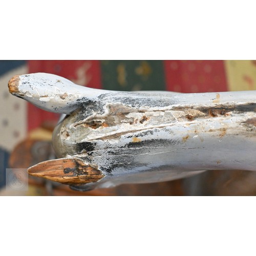 588 - An antique dapple grey painted wooden rocking horse with leather saddle, probably by FH Ayres, raise... 