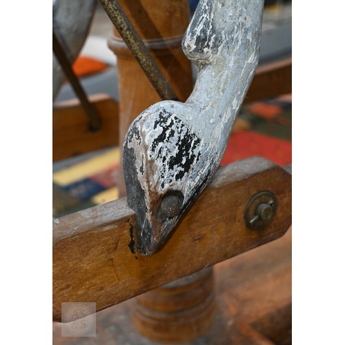 588 - An antique dapple grey painted wooden rocking horse with leather saddle, probably by FH Ayres, raise... 