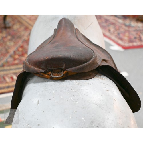 588 - An antique dapple grey painted wooden rocking horse with leather saddle, probably by FH Ayres, raise... 
