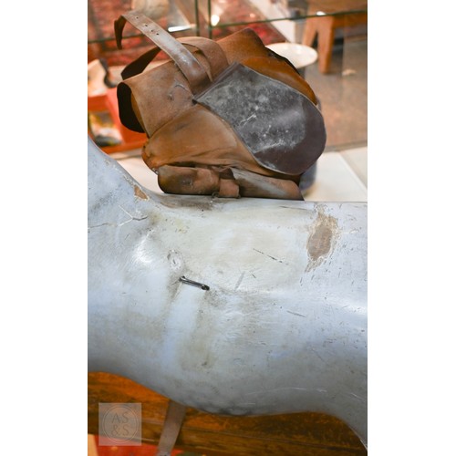 588 - An antique dapple grey painted wooden rocking horse with leather saddle, probably by FH Ayres, raise... 