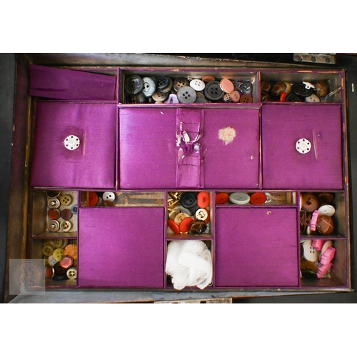 A Victorian mahogany tea caddy with two compartments flanking a glass ...