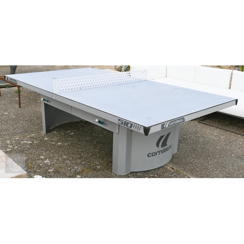 6 - A weathered 'Cornilleau' all-weather table tennis table, c/w four bats