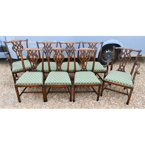 A set of eight Chippendale style mahogany dining chairs, pierced vertical splats over green foliate lattice fabric pad seats, six standard and two carvers (8)