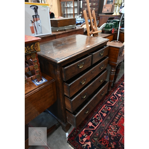 32 - An antique and later elm chest of two short over three long drawers with brass handles standing on s... 