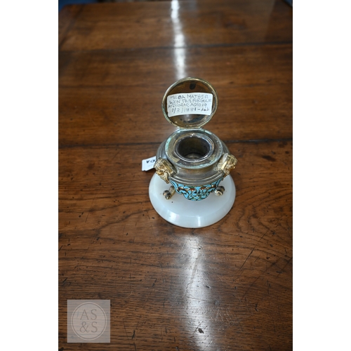 A 19th century ormolu and champlevé enamel inkwell on three scroll ...