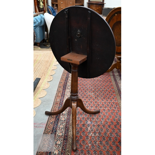 51 - A 19th century and later mahogany tilt-top occasional table with circular cross-banded top on turned... 