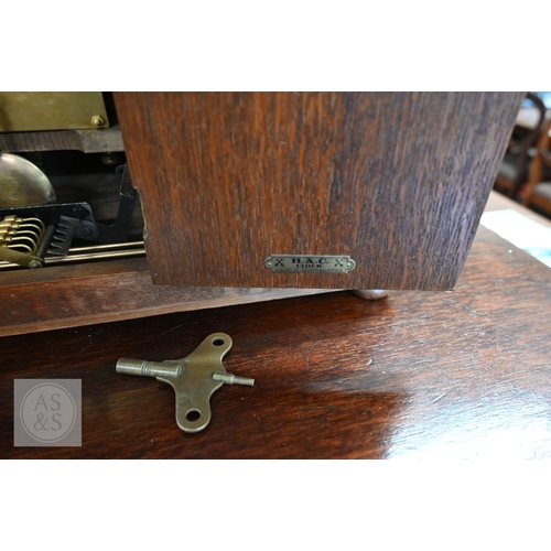 53 - A 1920s HAC tambour oak cased three-train mantel clock, 28 cm high to/w a late 19th century french s... 