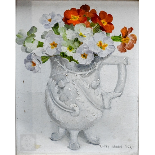 651 - Audrey Johnson (1918-2010) - 'Primulas in a white jug', still life study, oil on board, signed and d... 