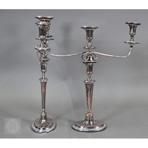 14 - A pair of plated on copper Adam Revival twin-branch candelabra, each with three sconces, on fluted o... 