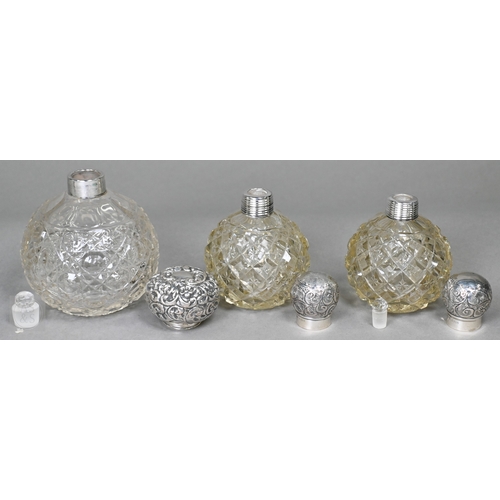 19 - A selection of late Victorian and later cut-glass scent bottles with silver mounts, to/w a ring-box,... 