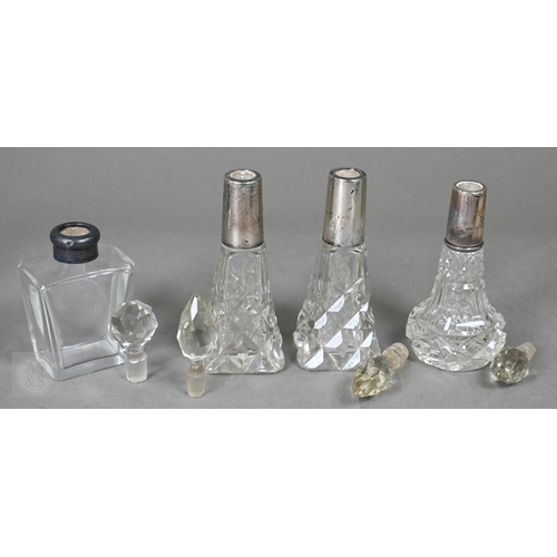 19 - A selection of late Victorian and later cut-glass scent bottles with silver mounts, to/w a ring-box,... 