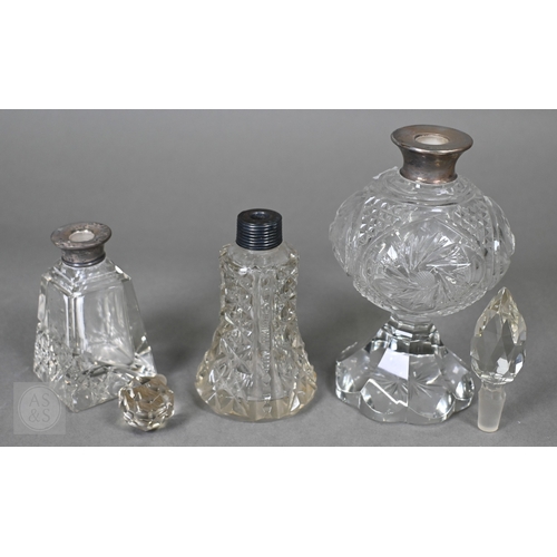19 - A selection of late Victorian and later cut-glass scent bottles with silver mounts, to/w a ring-box,... 