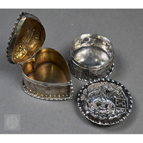 29 - A late Victorian silver heart-shaped trinket box with embossed scroll decoration to the hinged top, ... 