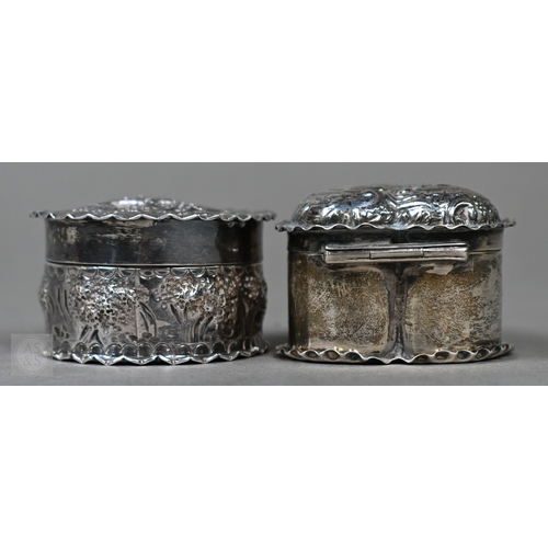 29 - A late Victorian silver heart-shaped trinket box with embossed scroll decoration to the hinged top, ... 