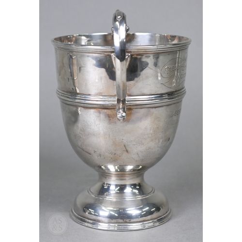 30 - Two silver trophy cups with twin handles and stemmed bases, Birmingham 1906/London 1947, 18ozt total... 