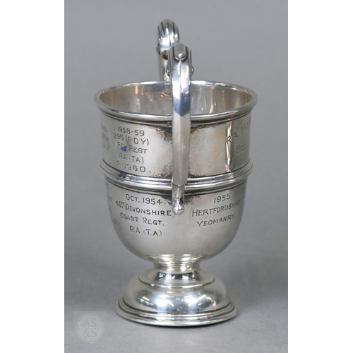 30 - Two silver trophy cups with twin handles and stemmed bases, Birmingham 1906/London 1947, 18ozt total... 
