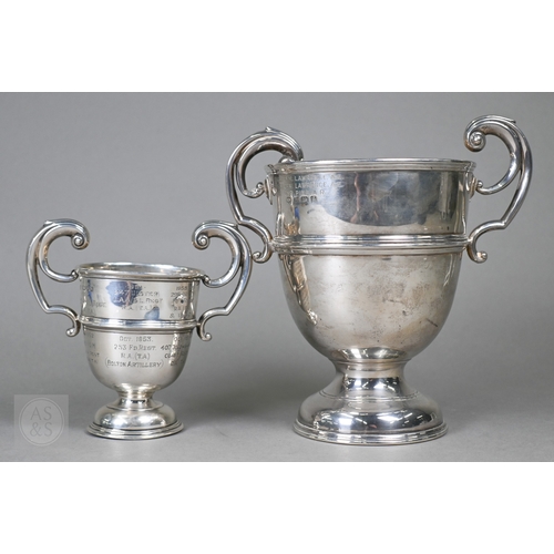 30 - Two silver trophy cups with twin handles and stemmed bases, Birmingham 1906/London 1947, 18ozt total... 
