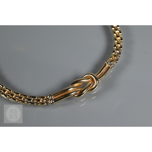 351 - A Continental brick link necklace, bracelet and earring set, with central knot design, yellow and wh... 