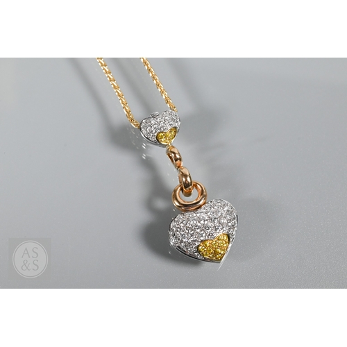 388 - A diamond pendant on chain and earring suite, the double heart drop pendant pavé set with round bril... 