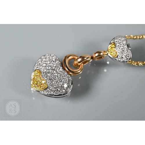 388 - A diamond pendant on chain and earring suite, the double heart drop pendant pavé set with round bril... 