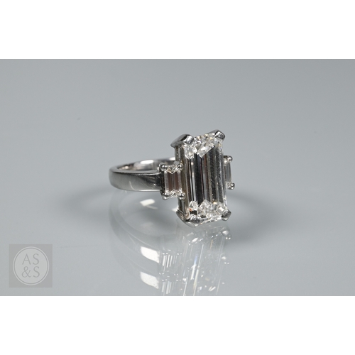 An exceptional diamond ring, the cut-cornered step-cut diamond with ...