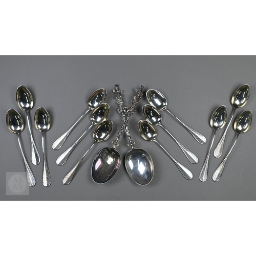 48 - A pair of Continental silver cabinet spoons, the ornate cast stems with seated figure finials, Londo... 