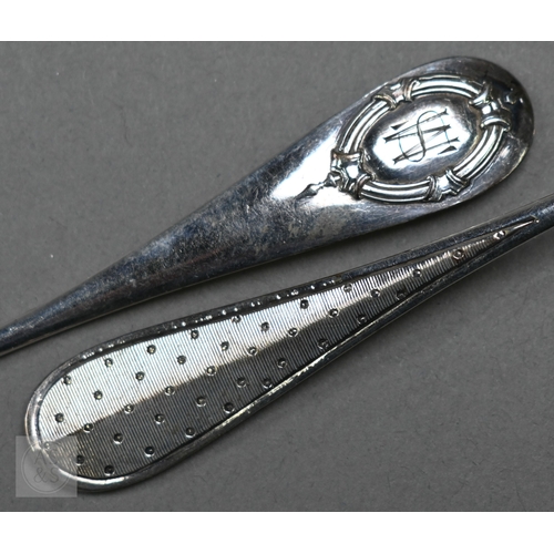 48 - A pair of Continental silver cabinet spoons, the ornate cast stems with seated figure finials, Londo... 