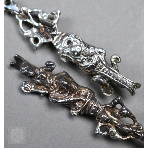 48 - A pair of Continental silver cabinet spoons, the ornate cast stems with seated figure finials, Londo... 