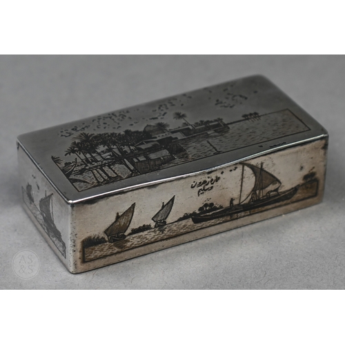 49 - An antique Egyptian unmarked (and untested) white metal snuff box with niello decoration of Nile vie... 