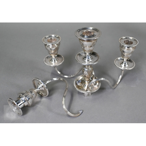 5 - A pair of late Victorian/Edwardian Adam Revival three-branch candelabra, each with four urn-shaped s... 