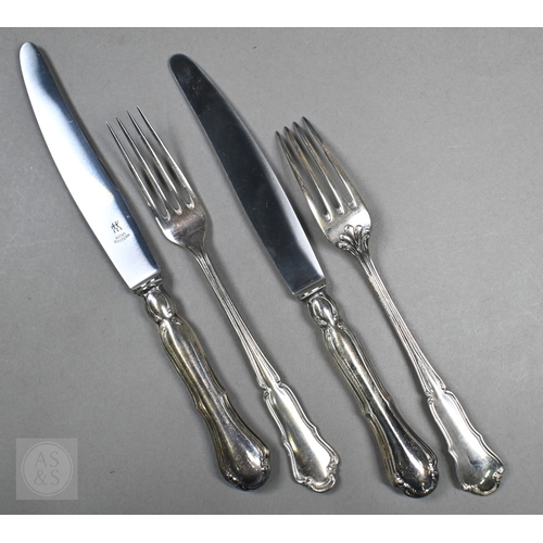 51 - A set of six German .800 grade table forks and two matching serving spoons and a fork with vestigial... 