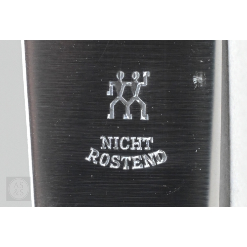 51 - A set of six German .800 grade table forks and two matching serving spoons and a fork with vestigial... 