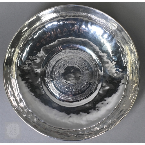 53 - A vintage Middle Eastern white metal bowl with calligraphic central roundel, 14.2ozt, 23cm diameter