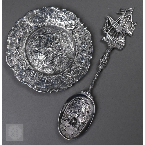 55 - A Continental .800 grade ornate pierced bowl, embossed and chased with Bacchanalian putti, 20cm wide... 