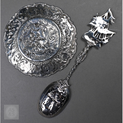 55 - A Continental .800 grade ornate pierced bowl, embossed and chased with Bacchanalian putti, 20cm wide... 