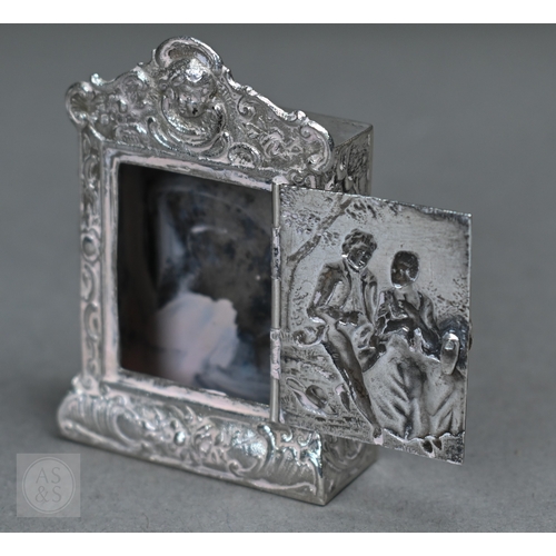 55 - A Continental .800 grade ornate pierced bowl, embossed and chased with Bacchanalian putti, 20cm wide... 