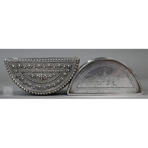 58 - A pair of Indian low-grade silver boxes oc crescent form, richly-embossed with foliage and beading, ... 