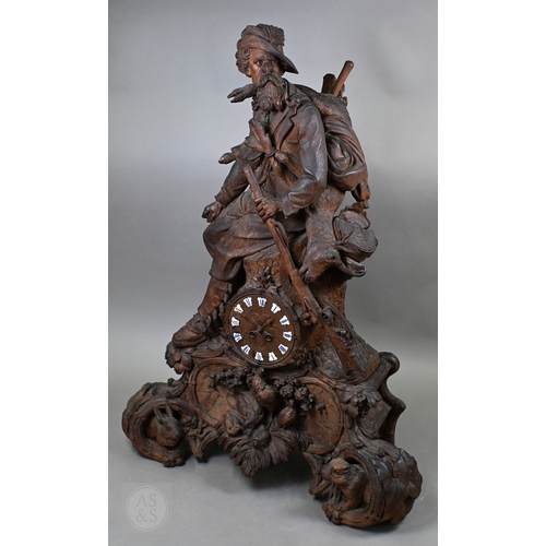 810 - J Huggler (1834-1912) a monumental carved Black Forest clock, late 19th century, carved as a seated ...